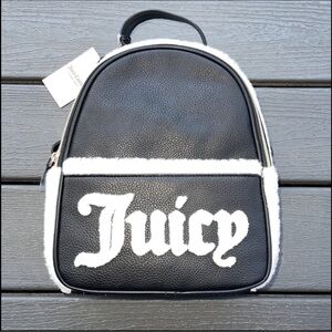 This stunning black and white Juicy Couture backpack purse